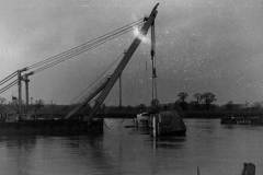 Raising the MV Birgit Muller on the River Ouse.                         