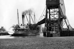 A steam collier alongside one of Goole's hoists, whilst being loaded with coal.