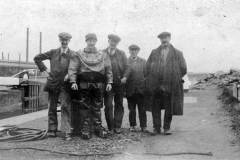 A British Waterways diver posing posing with his four man support team.