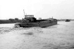 Two unladen barges under way.