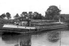 A moored, fully-laden motor barge.
