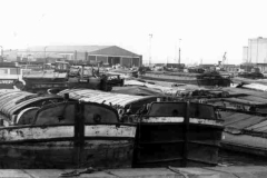 A dock full of barges.