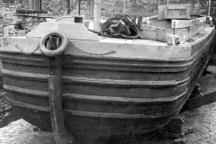 A dumb barge undergoing repairs.