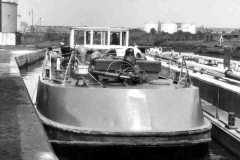 Two tanker barges alongside a depot.
