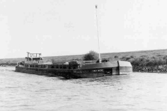 Barge Carimor underway with its hatch boards neatly stacked.