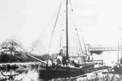 A moored, fully rigged Humber sloop.
