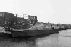 Narrowboats loading from a hopper.