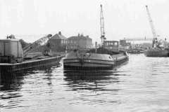 Two coal-laden motor barges under way.