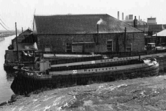 Three moored motor barges.