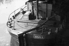 The typical rudder tiller and companionway on the barge Highliffe.