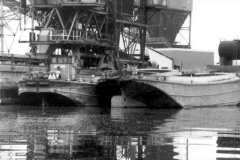 Moored motor and dumb barges.