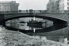 Towing a barge under Leeds Bridge.