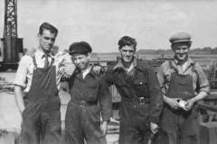 A work team posing for the photographer.