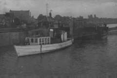 OUSE TENDER towing a compartment boat.